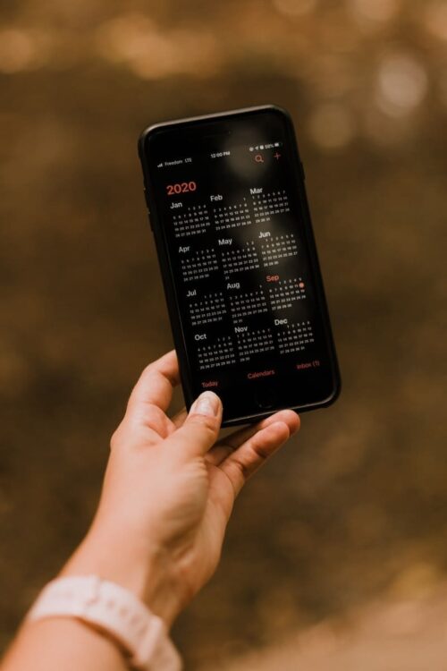 person holding black android smartphone, regular streaming schedule