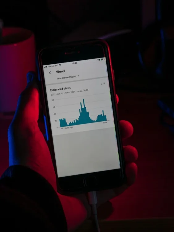person holding black iphone 5, streaming analytics